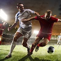 football players playing at football match